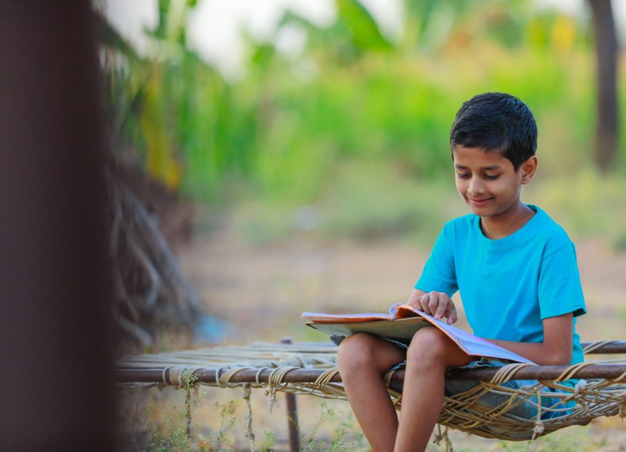 Cute indian child studying at home